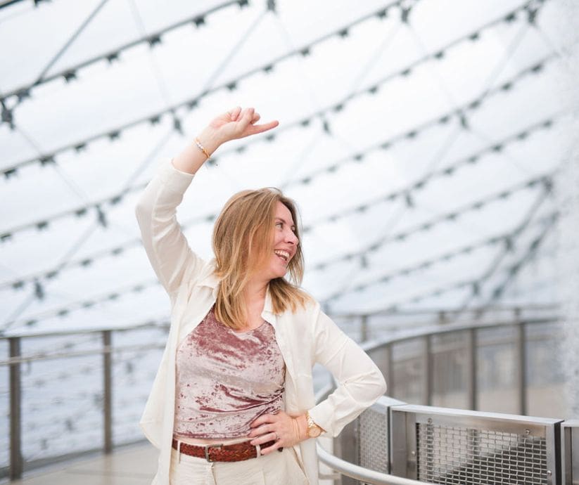 Picture of Jenna Harding Smiling and Pointing to the Side | Brand Messaging Blog Post